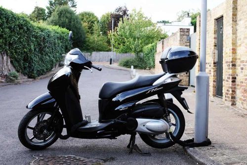 Scooter secured on a street